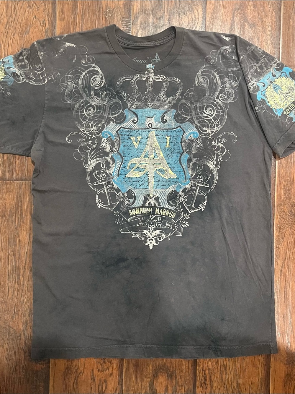 Aqua Black Short-Sleeve Tee with Blue and Cream Crest Graphic